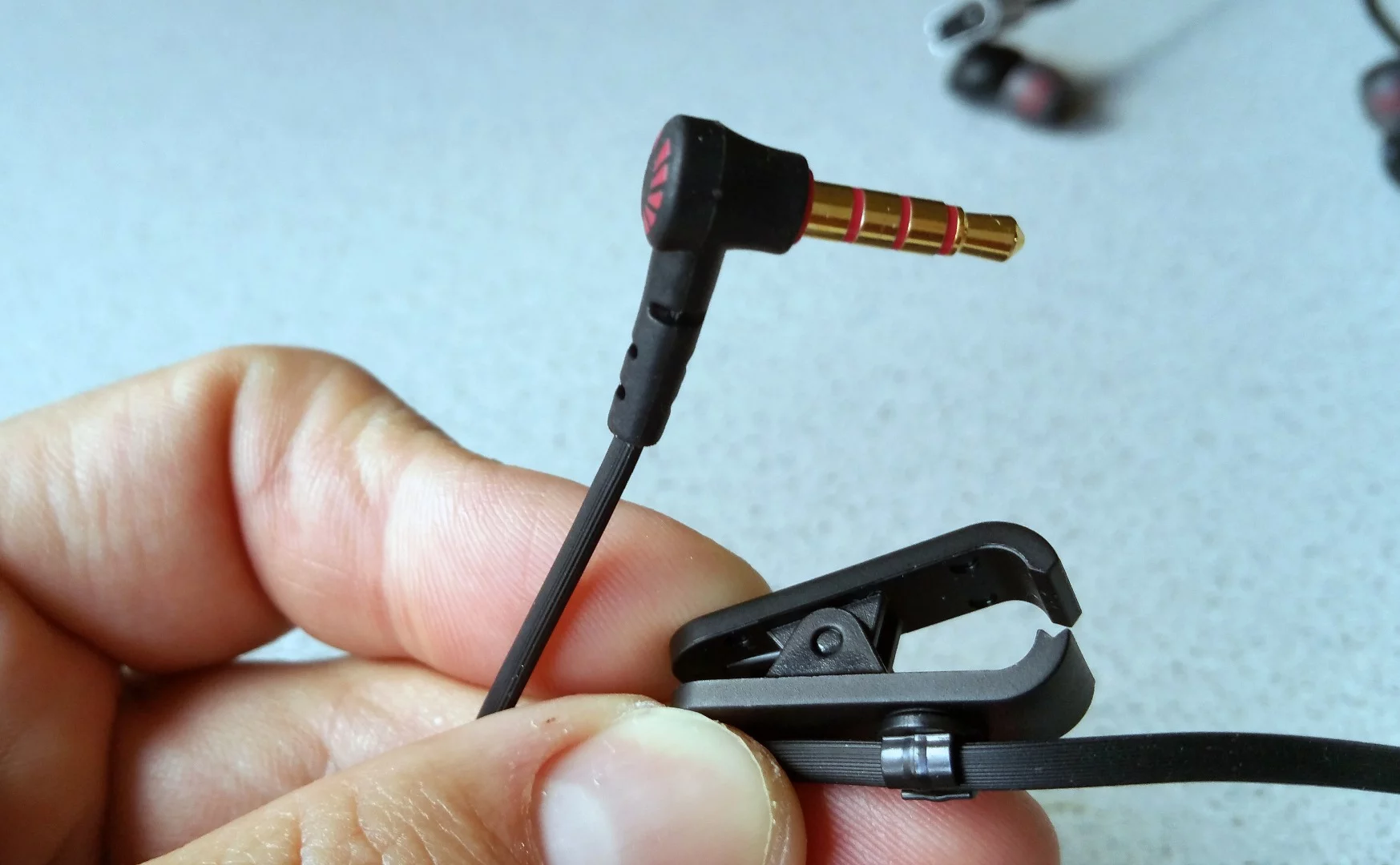 See that clip? Don't lose it, since it helps prevent the Phiaton PS 202 NC from hanging too heavily on the ears