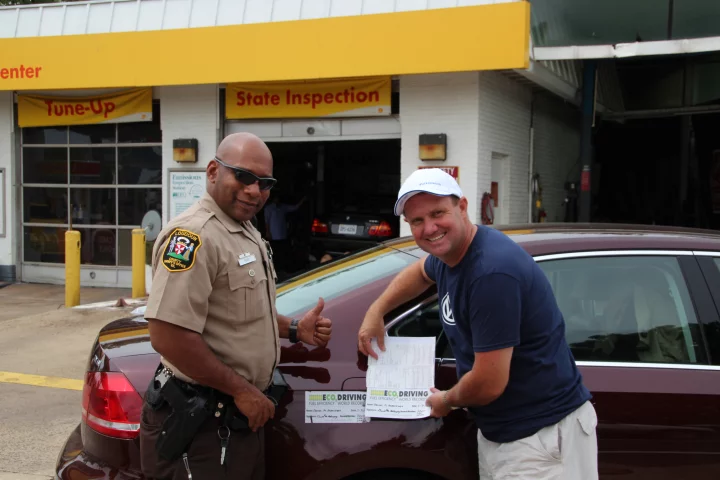 A Loudoun County, Virginia Sheriff’s Deputy verifies the car’s mileage before removing the fuel tank seal