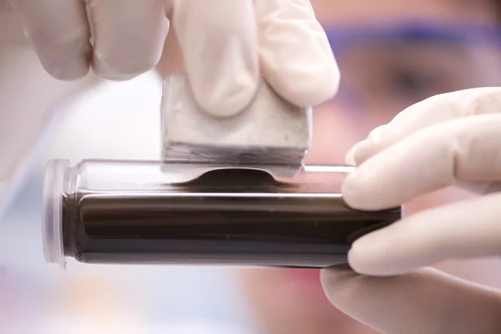 A demonstration of how the phosphorus-laden particles can be removed from water using a magnet