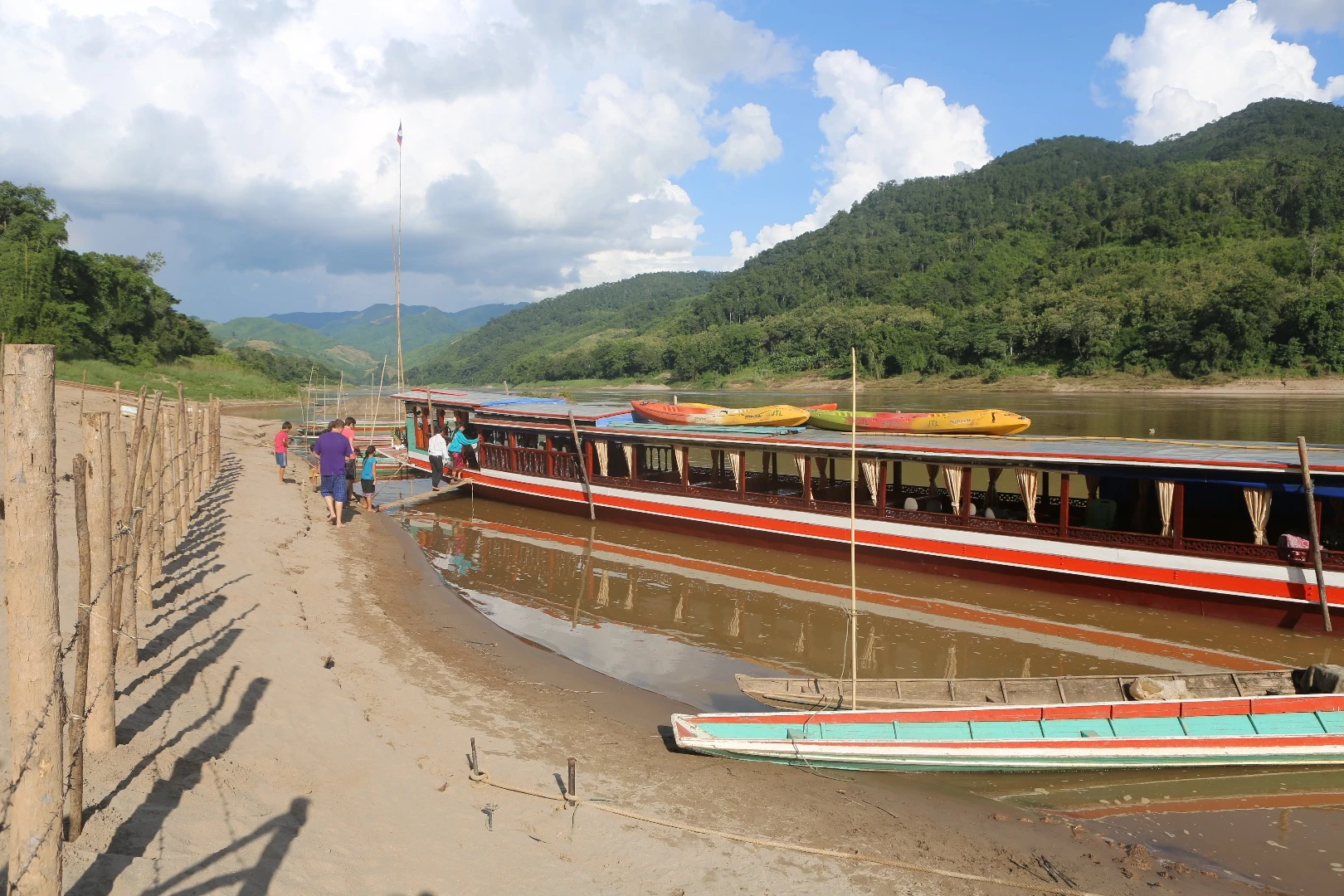 One of the Mekong's Slow Boats, with our kayaks on the roof.