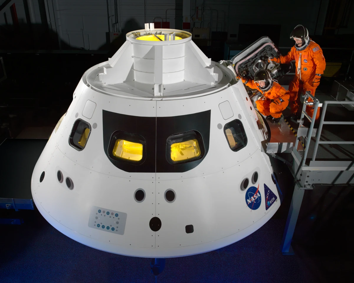 ACES suit being used on mock up the Orion (Image: NASA)