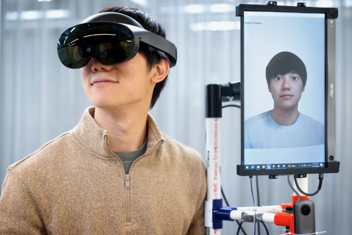 Mose Sakashita, a Cornell University doctoral student in the field of information science, with the VRoxy system