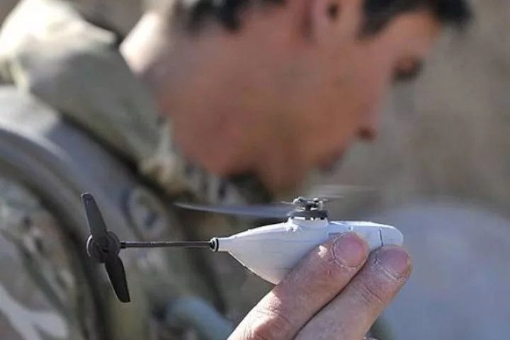 British soldiers in Afghanistan have been issued palm-sized Black Hornet Nano UAVs to scout around corners and obstacles for hidden dangers [Image: © Crown copyright]