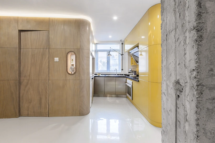 The fully equipped kitchen box adjoins the private bathroom box, which features a fold away dining table and a hidden entrance to the bathroom