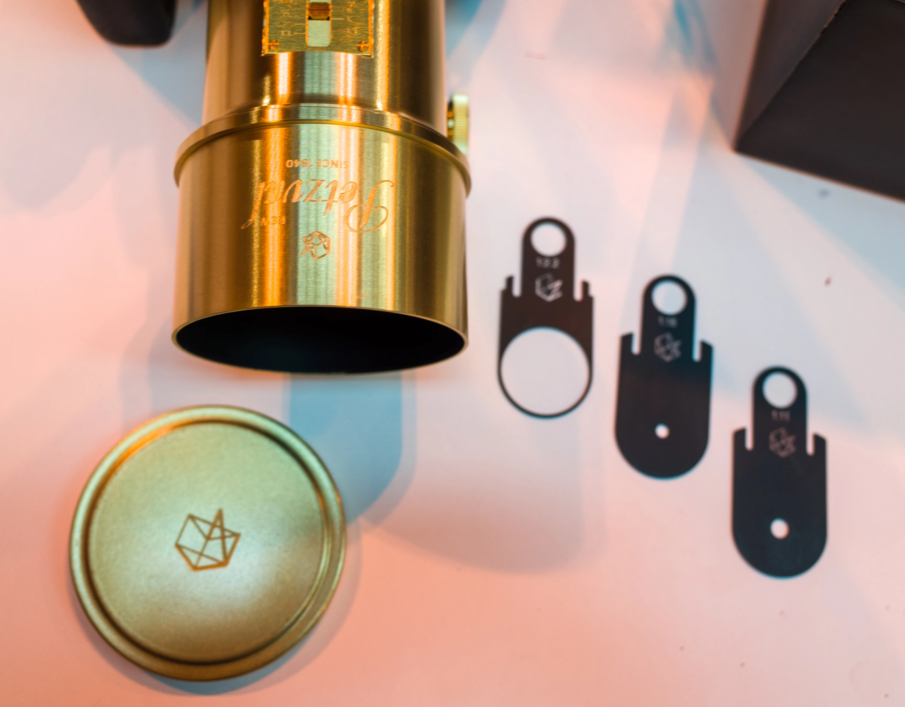 The Lomography New Petzval Art Lens features a brass lens cap