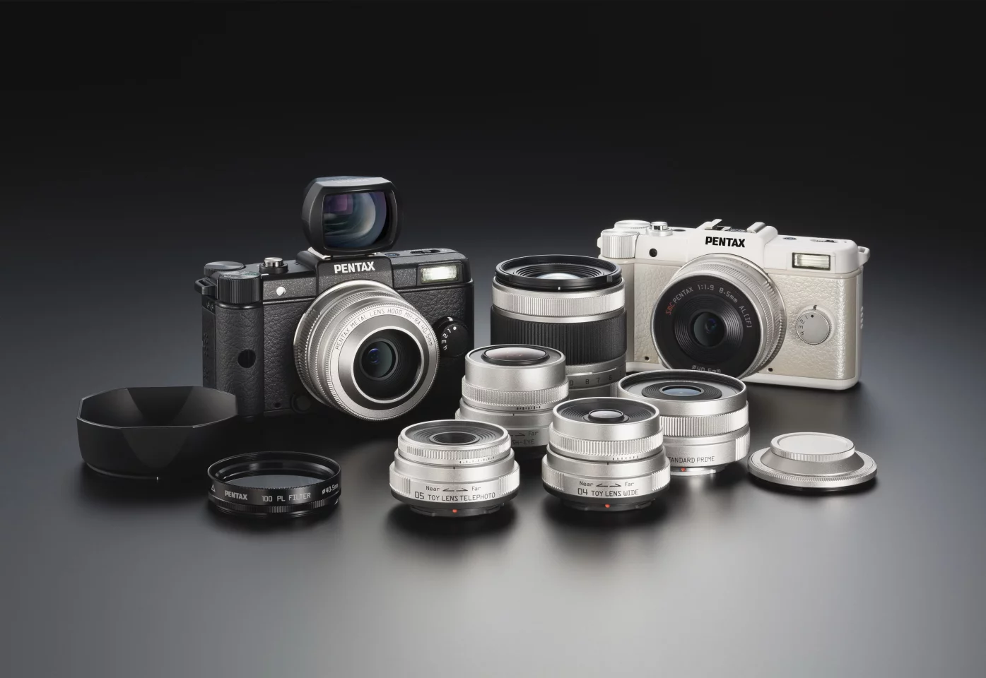 The new Penatx Q camera, shown with four new lenses and accessories