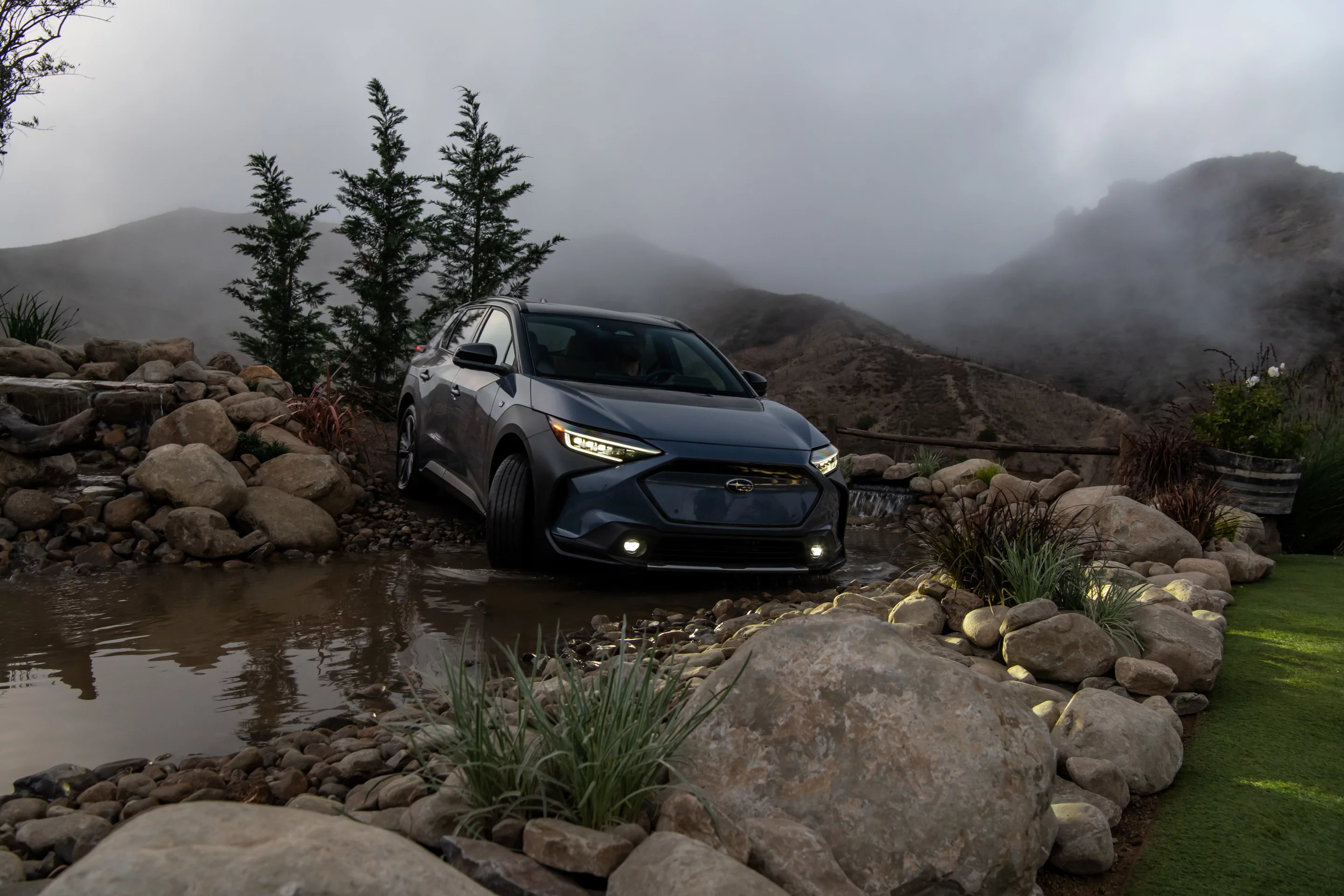This looks more like someone's koi pond than an actual stream crossing, but the Subaru Solterra handles it either way