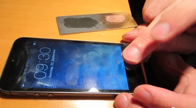 Hackers demonstrate a workaround to Apple's touted Touch ID system (photo from Starbug's video demoing the trick)