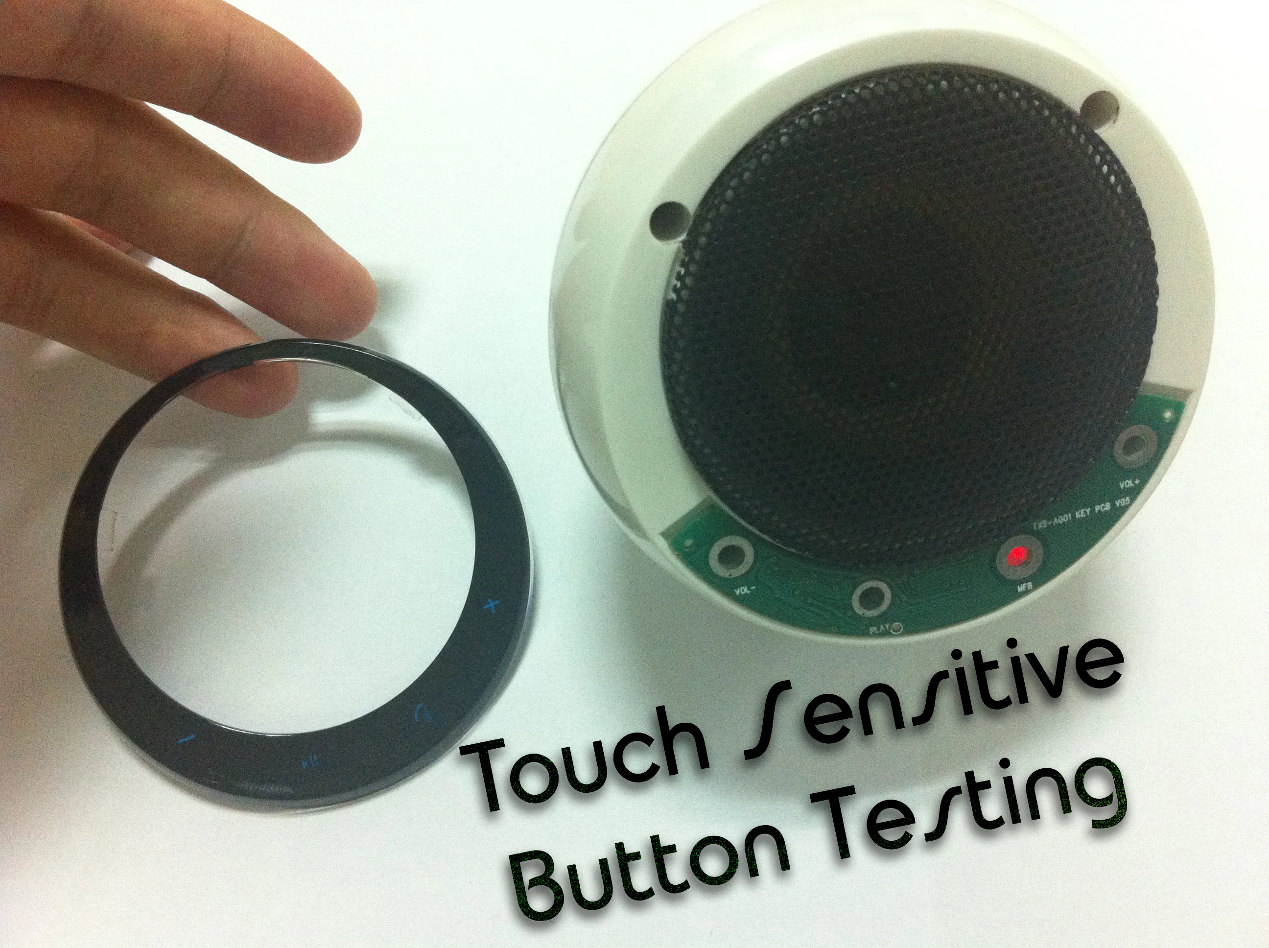 Each speaker grille is surrounded by a touch button interface