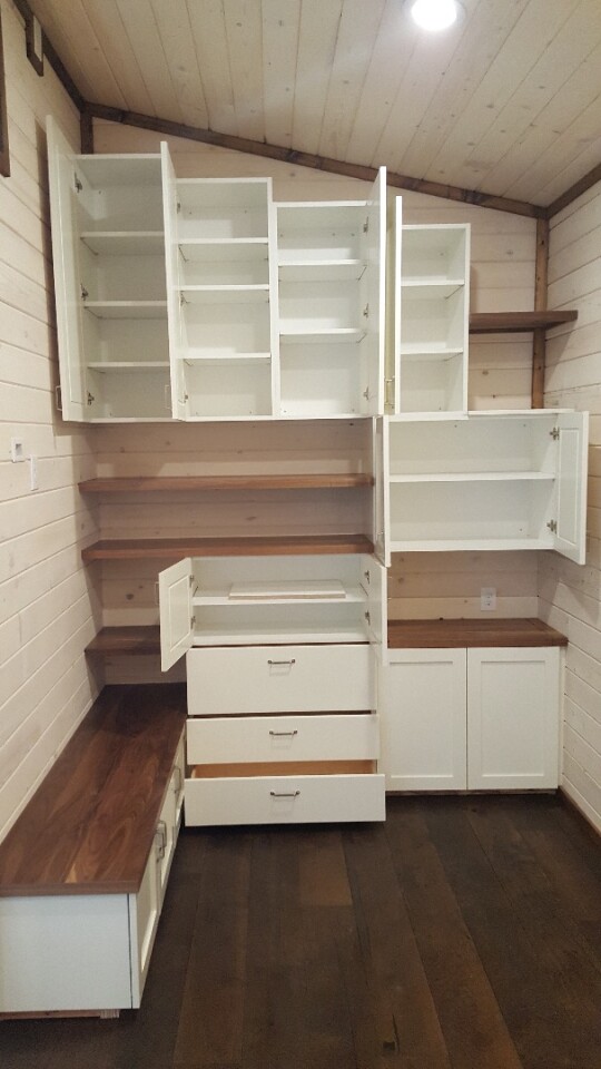 Custom cabinetry offers lots of storage space in the living room
