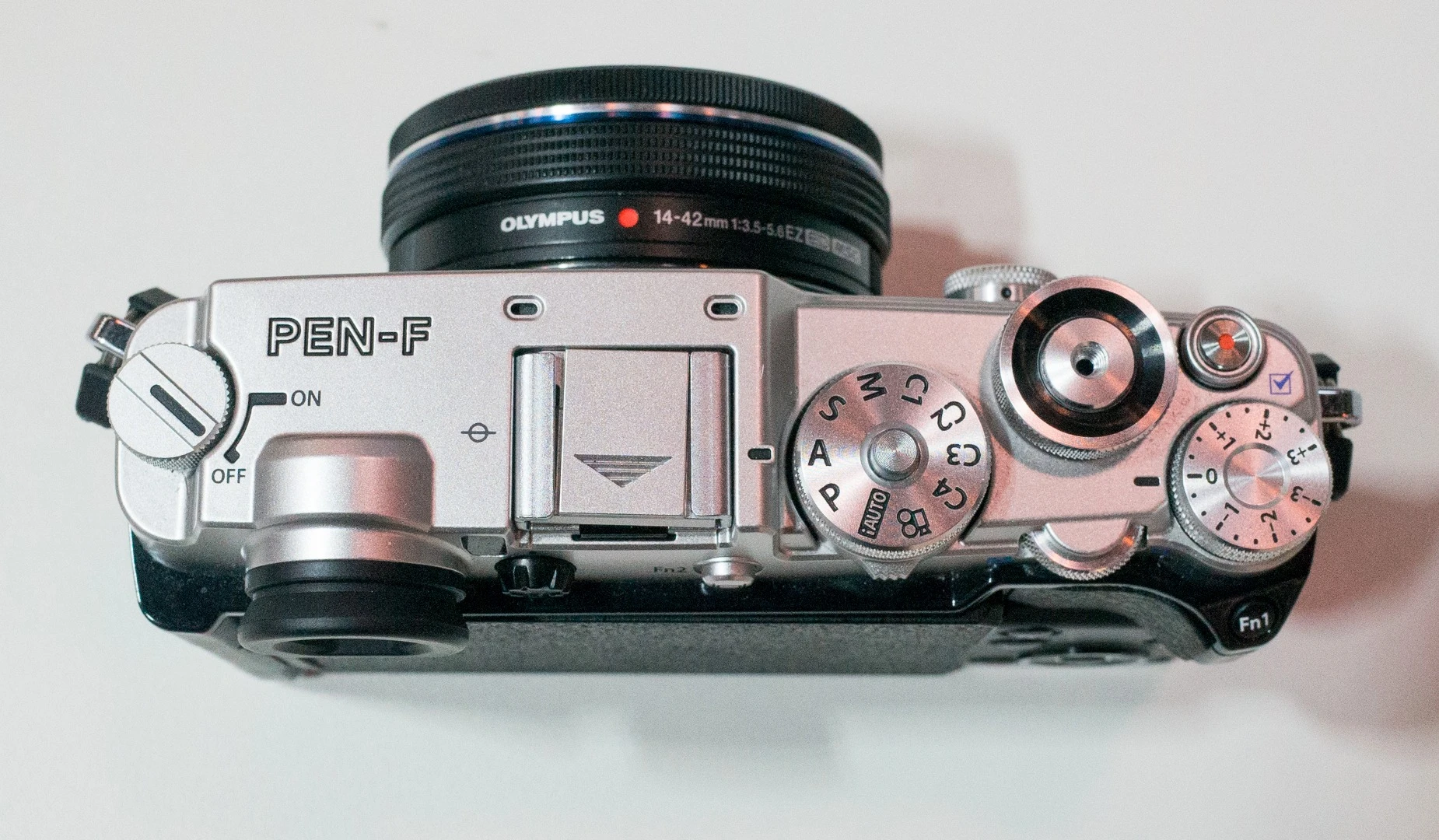 The top dial of the Olympus PEN-F now features access to custom settings