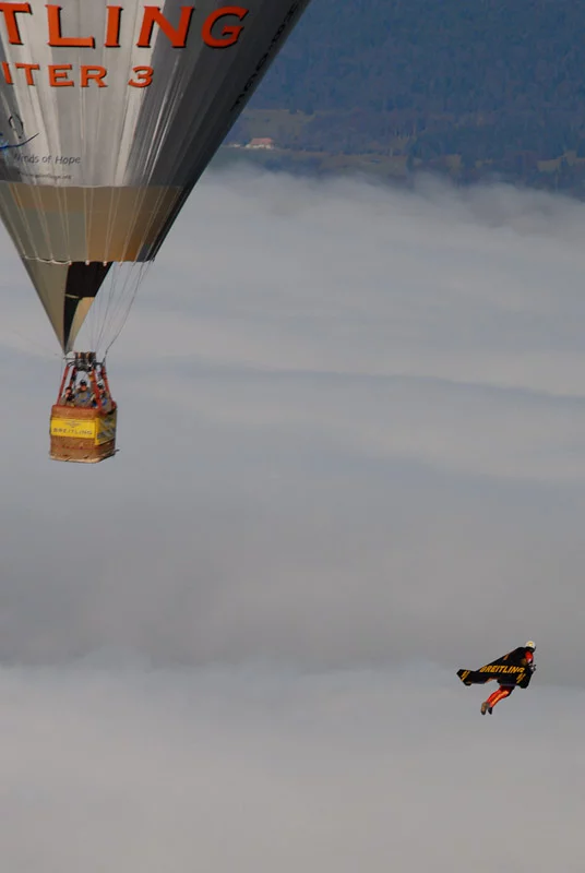 Swiss 'Jetman' Yves Rossy has successfully performed two aerial loops, using his unique strap-on jet-powered wing