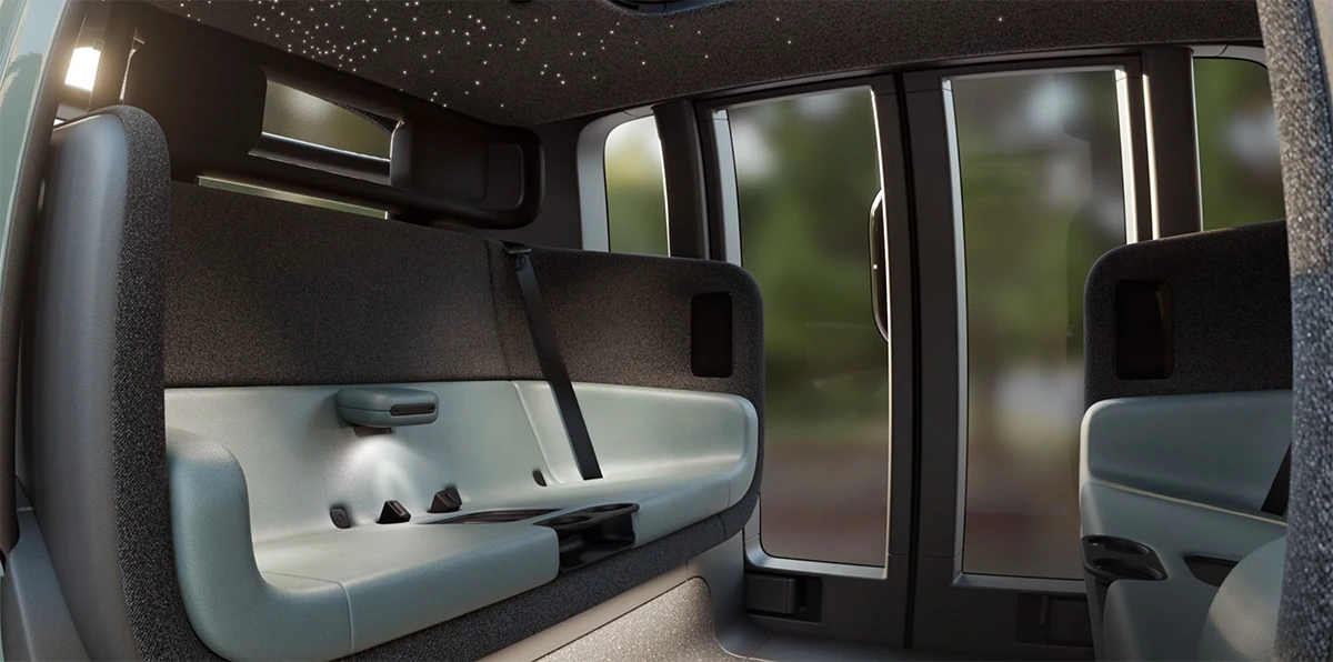 The roomy cabins include wireless charging docks, personalized climate control and lighting, and screens displaying your ETA