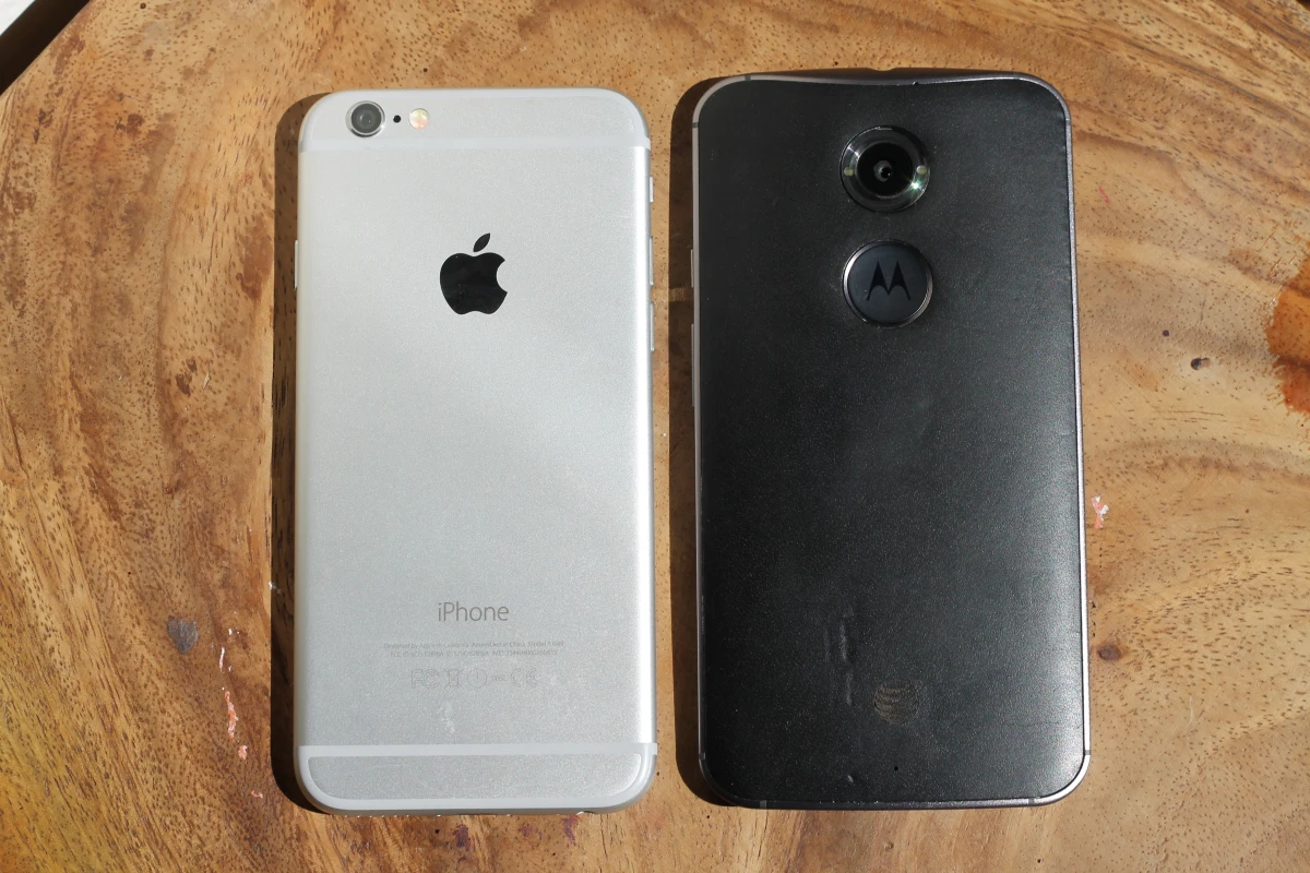 The Moto X in leather and the iPhone 6 in space gray