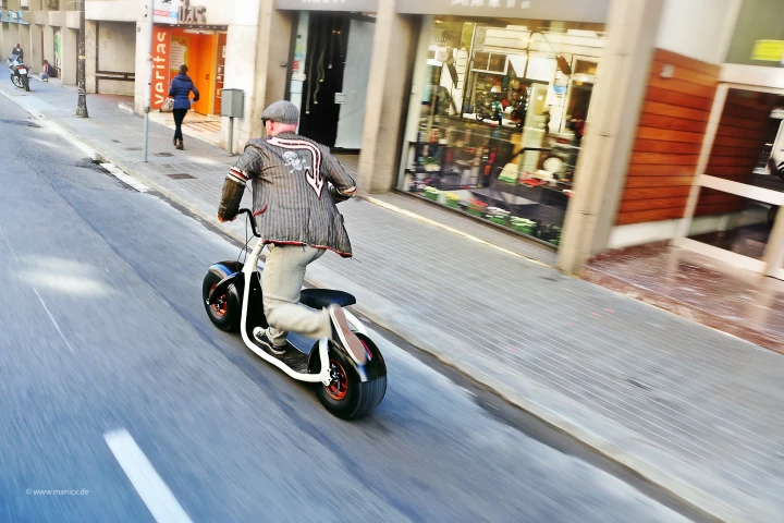 The Scrooser is an electric scooter that amplifies leg kicks delivered to the ground by its rider