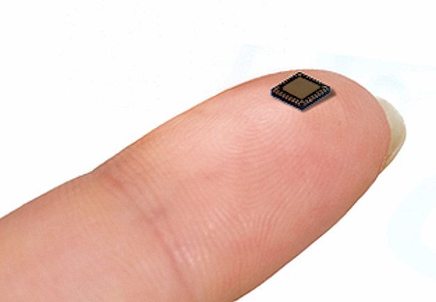 The MGC3130 chip in a 5x5mm package, resting on a fingertip