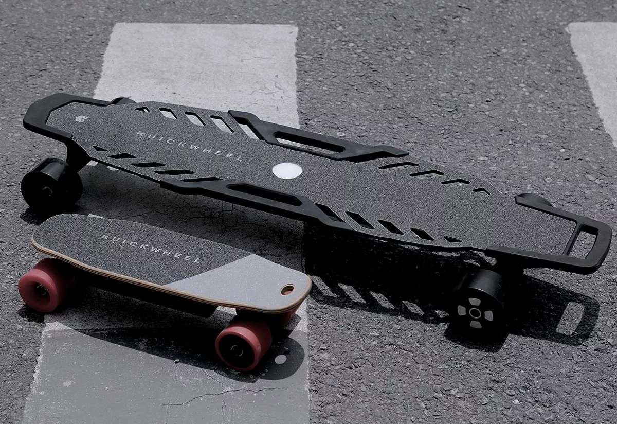 The Serpent-C (bottom left) and Serpent-W electric skateboards from Kuickwheel