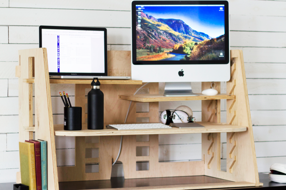 The Perch desk is desktop-mounted, allowing users to raise or lower their work equipment on separate platforms when standing or sitting