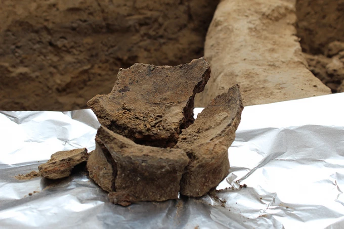 The base of an ancient jar, which was found to contain chemical traces of tartaric, malic, succinic and citric acids – all indicators of wine