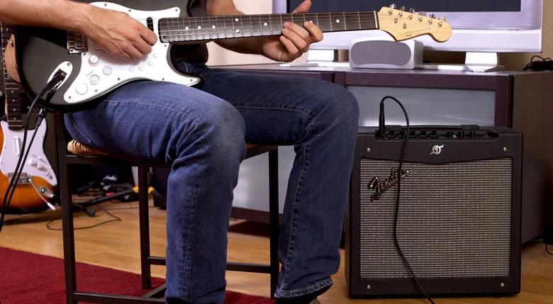 The Squier Strat can also be plugged into an amp and played like a real guitar
