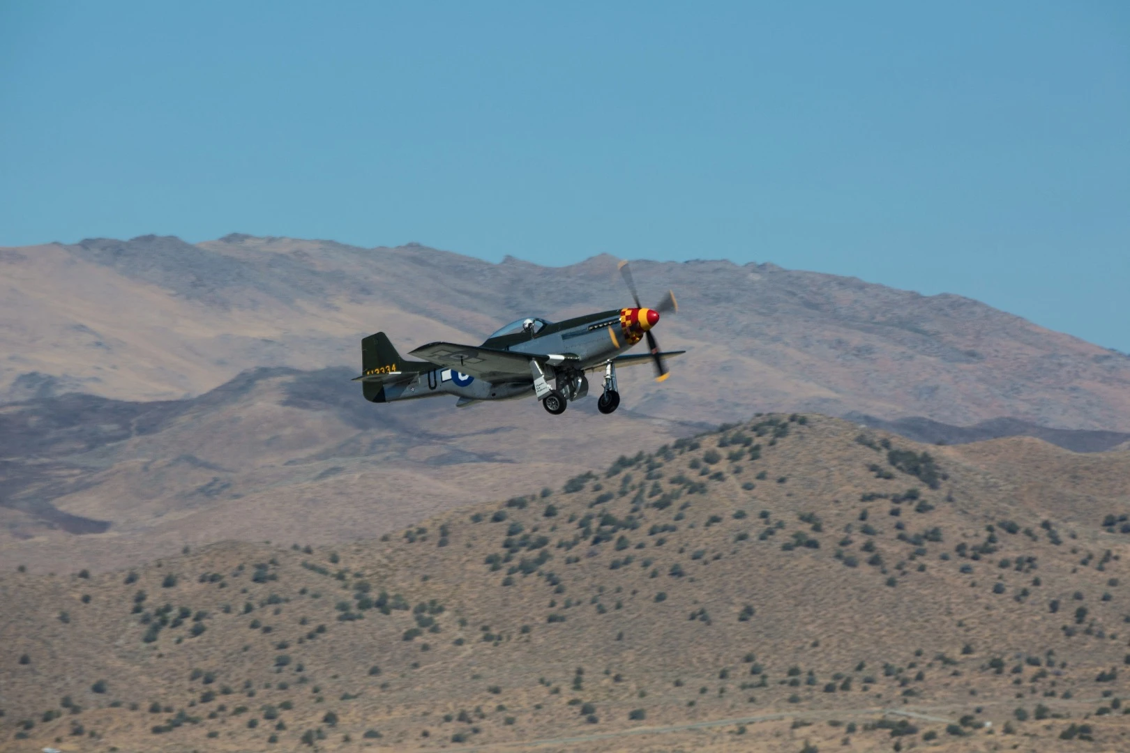 Race #0, a P-51D Mustang, takes off in the Unlimited class