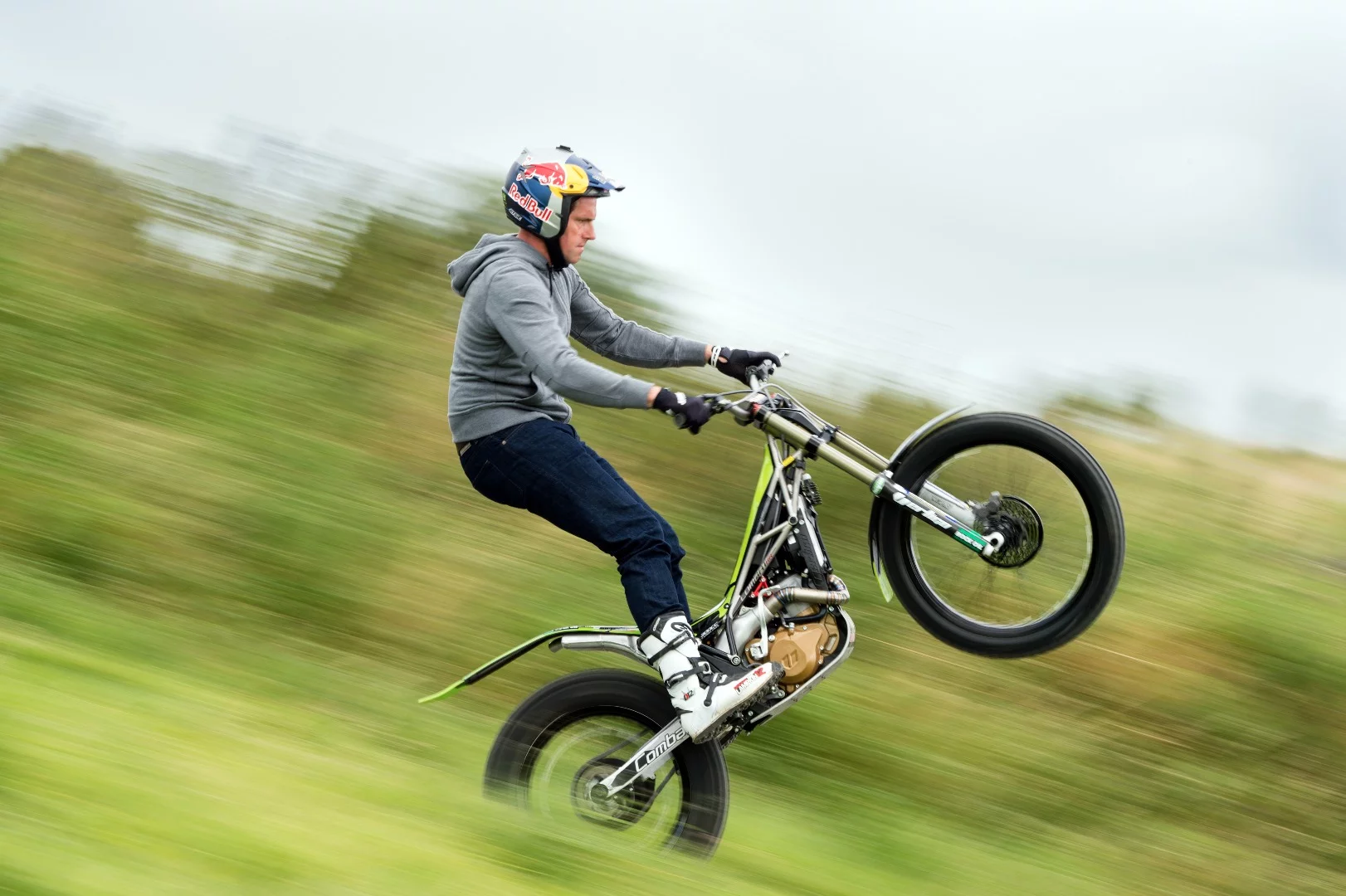 Throttle against rear brake, with body positioned for balance and steering