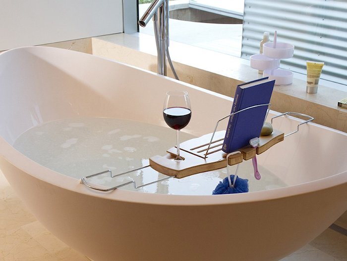 The Umbra Aquala bathtub caddy provides a dry place to put your drink, soap, book or tablet