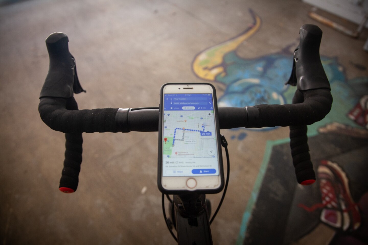The Quad Lock uses a set of four tabs to lock a smartphone in place