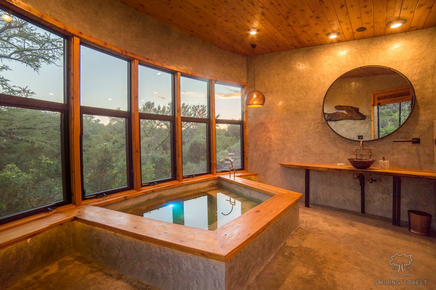 Yoki House's bathroom features expansive windows to facilitate bird watching and stargazing directly from the soaking tub