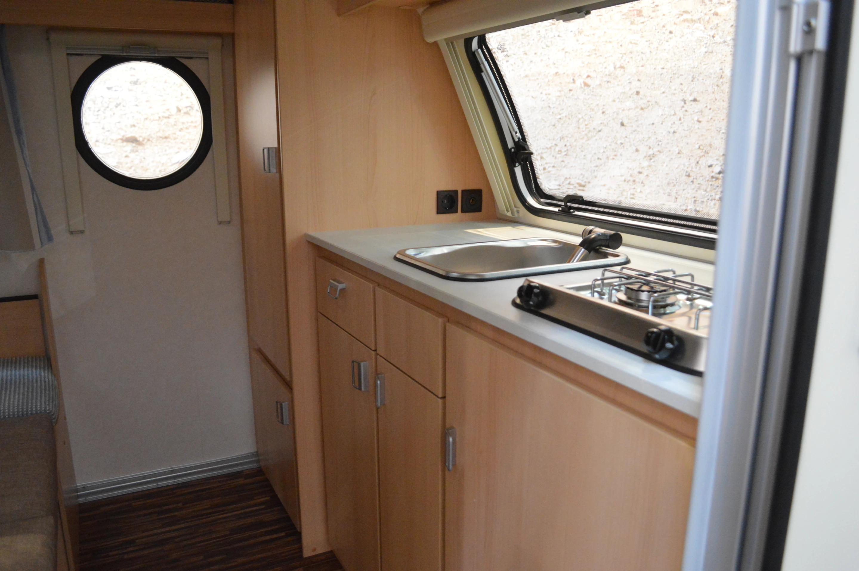 Unlike the Carreta, the T@b integrates both its bedding and kitchen inside the main cabin
