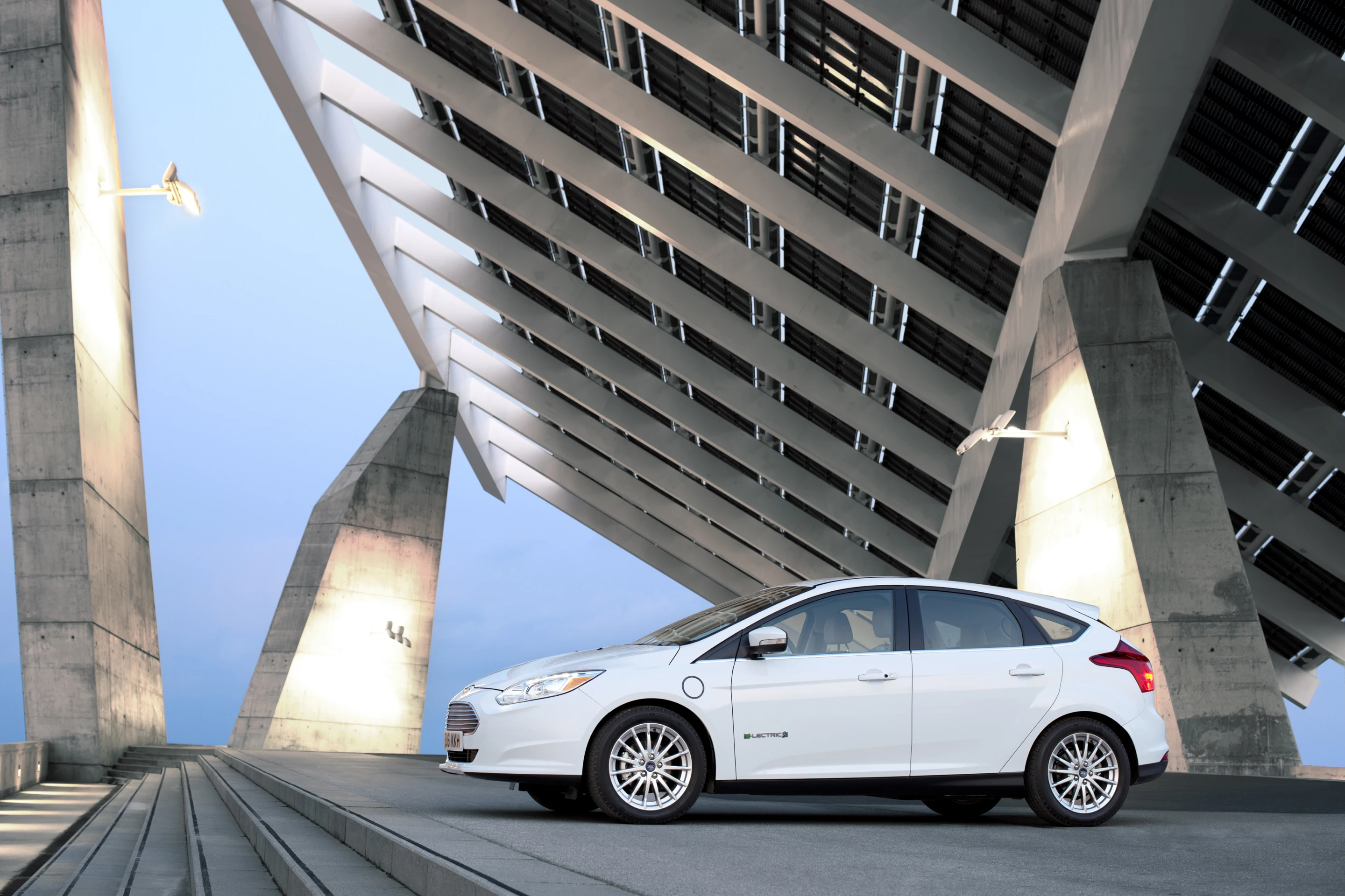 Attendees at the 2012 Geneva Motor Show are being given the first opportunity to actually get behind the steering wheel and drive Ford's first all-electric passenger car - the Focus Electric