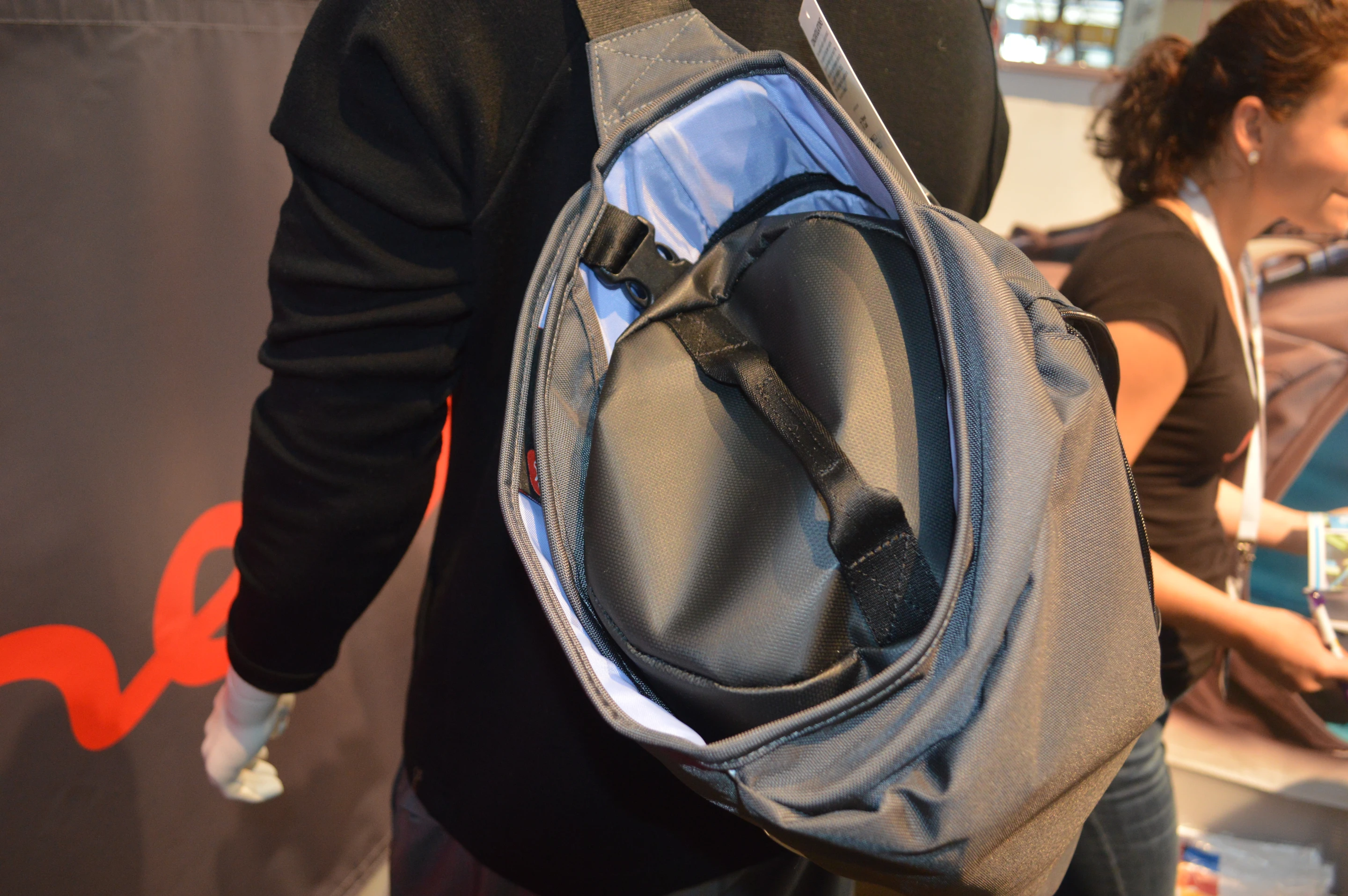 The removable gym bag slides inside the rolled suit bag