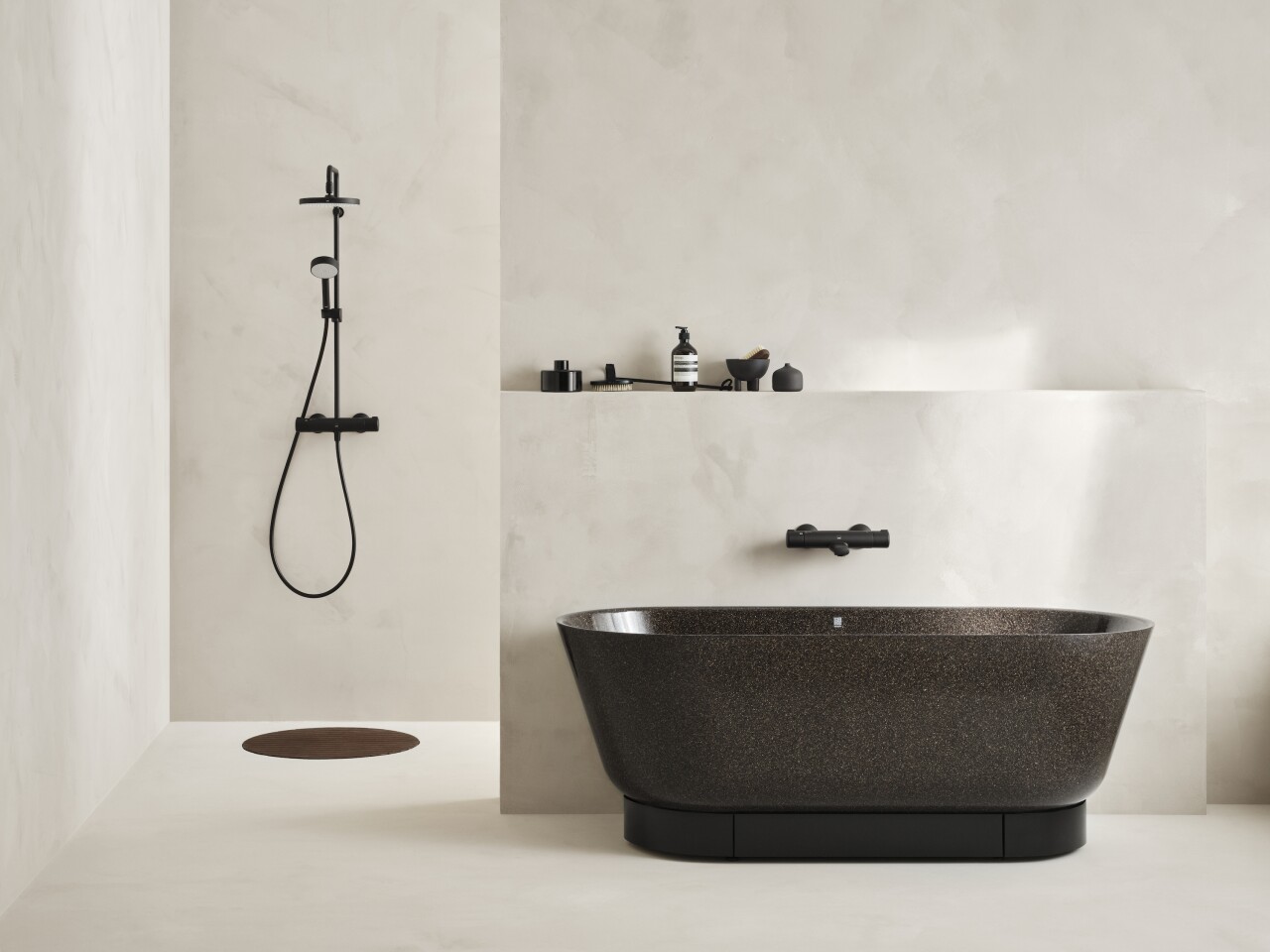 Woodio manufactures different types of composite wood bathroom ware, including a bathtub and a sink