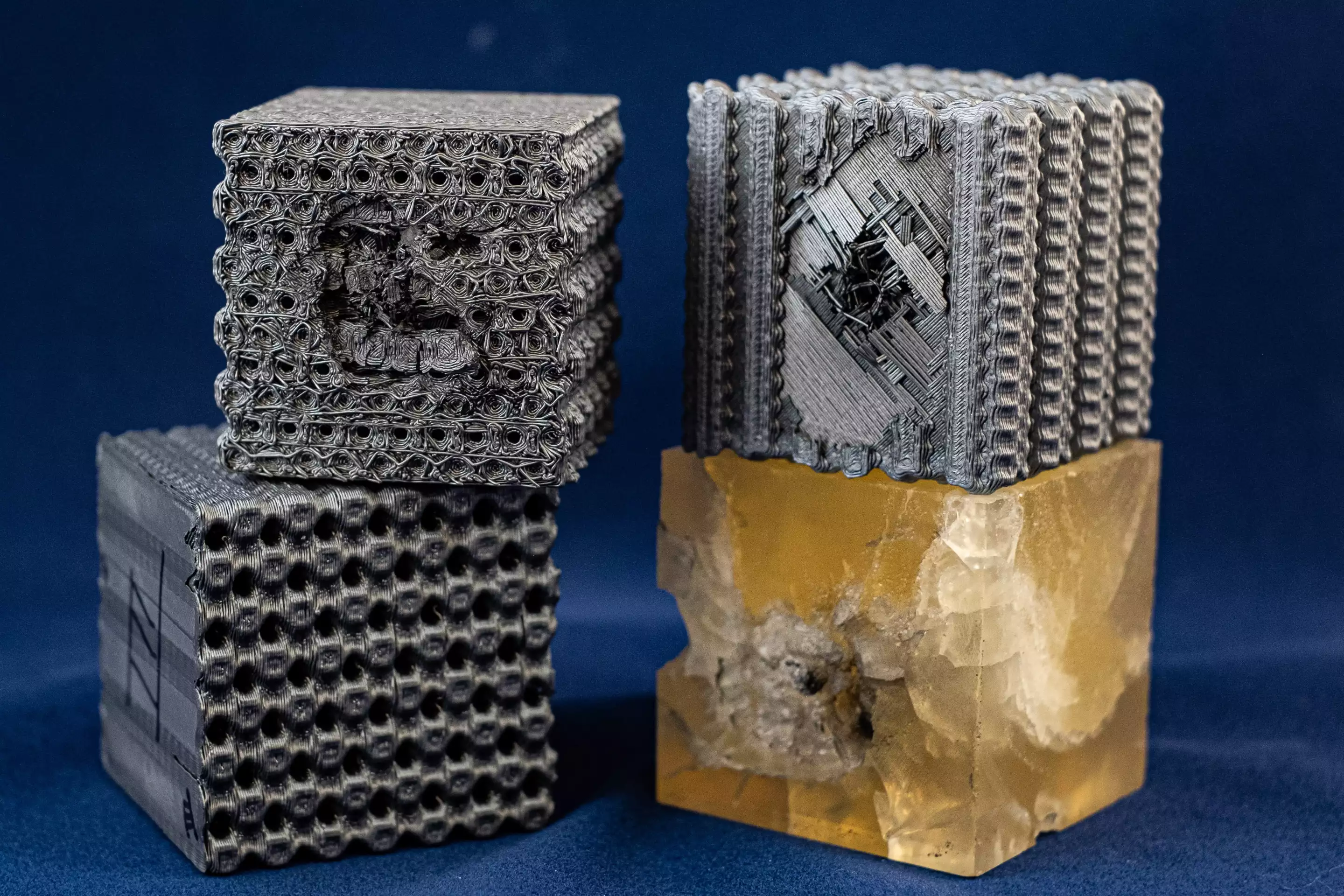 Rice University engineers blasted their lattice structures with bullets traveling at 5.8 km (3.6 mi) per second, with the cubes proving 10 times more effective at absorbing the impact than solid cubes made from the same polymer material