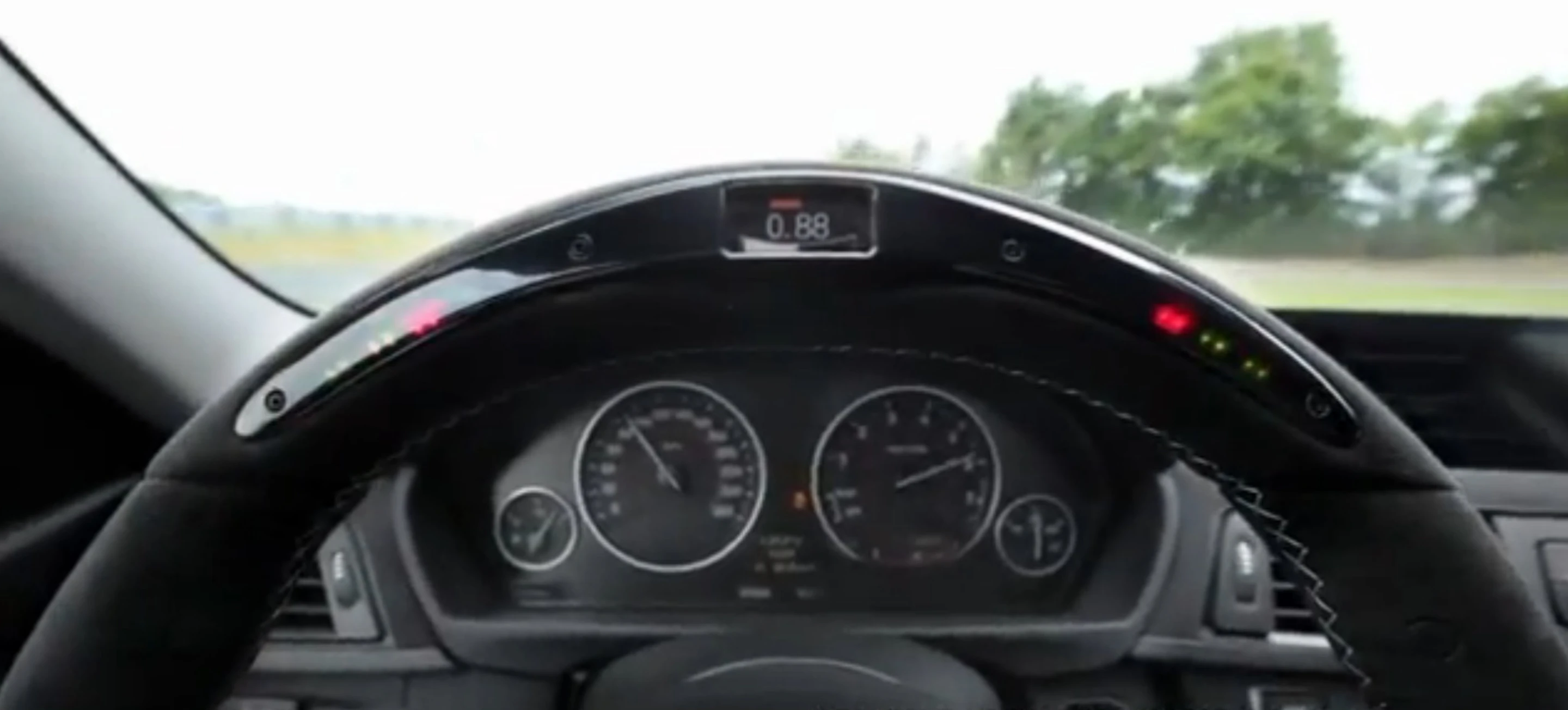 The BMW M Performance steering wheel showing turn acceleration