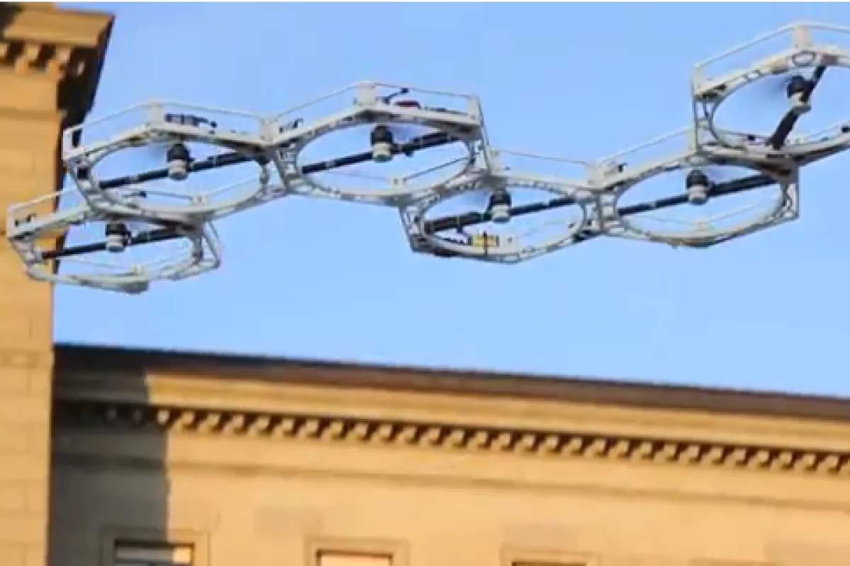 As the united band of robots hovers and climbs off the ground, each robot module is using inertial sensors to detect tilt and roll