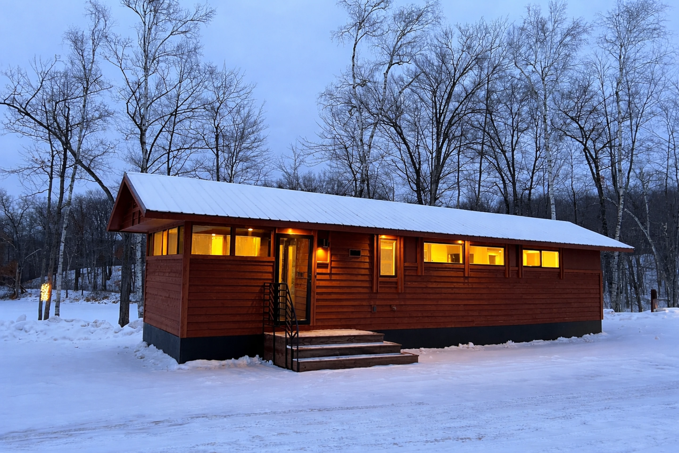 Park model tiny house with large windows and single level design offers ...