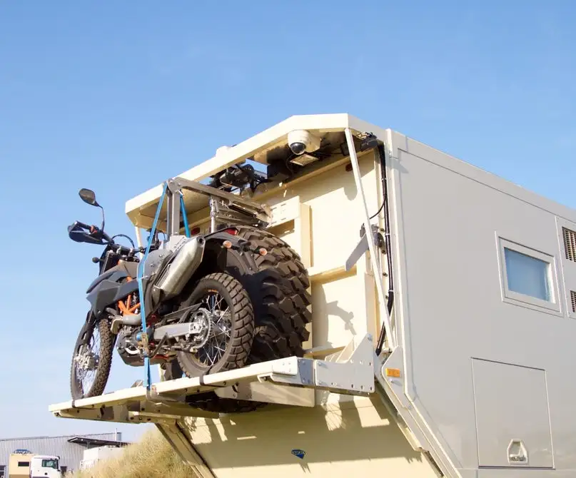 Because you might not want to drive a 6x6 around once you settle at camp, Unicat offers a motorcycle lift for the back