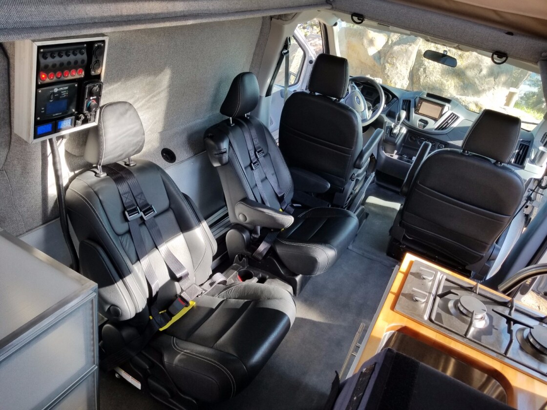 The middle seat is removed here but slides between the two rear captain's chairs, offering space for a child or small adult
