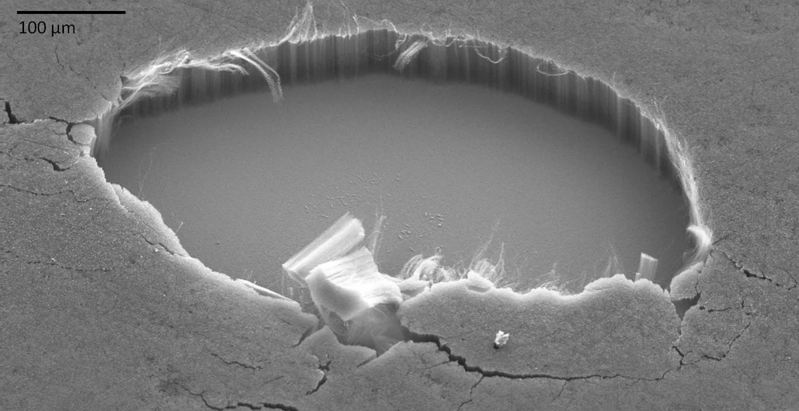 A section of the super-black coating, which was grown on smooth silicon, purposely removed to show the tubes' vertical alignment (Image: Stephanie Getty, NASA Goddard)