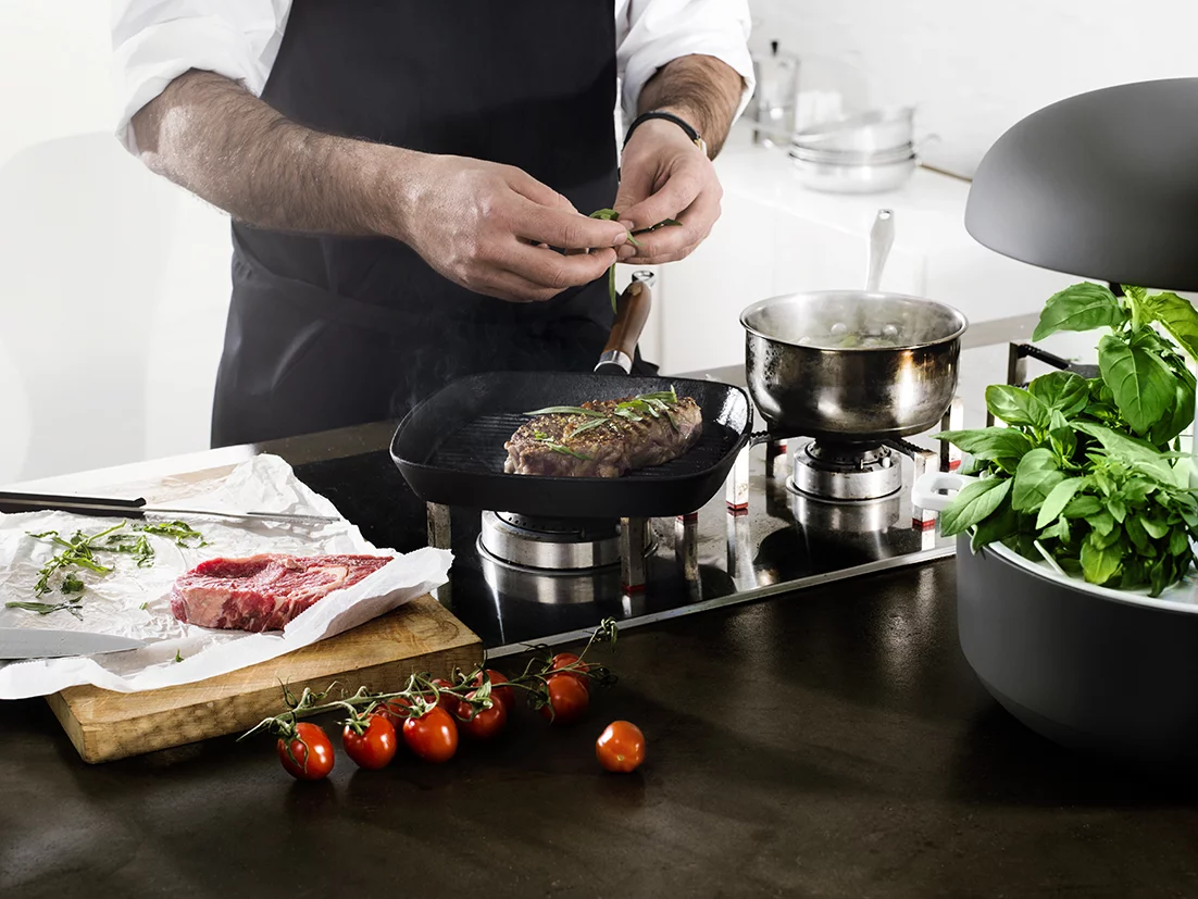 While the device can automatically adjust water and light according to the plant's growth, it allows the user to manipulate these settings to shape the final product