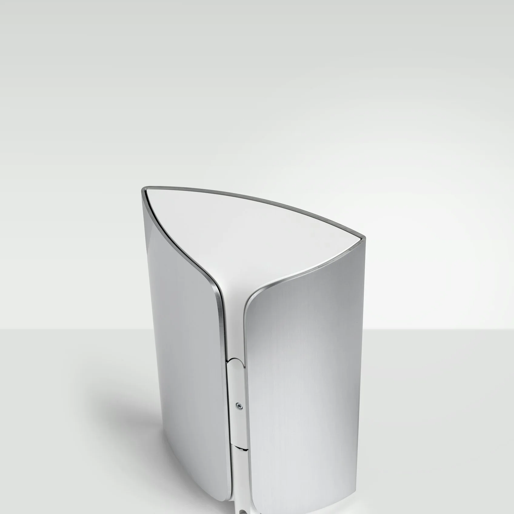 The wedge-shaped cabinet of the BeoLab 17 is made from a single piece of aluminum wrapped around composite material