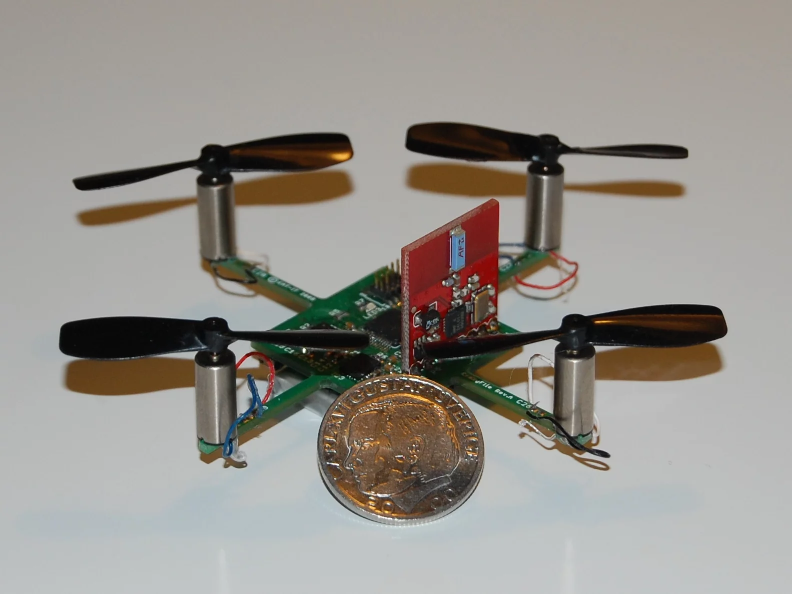 The first prototype Crazyflie quadcopters featured a main board with a 2.4 GHz radio sticking up