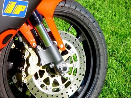 The Aprilia RS250 road bike has brakes the like of which will initially scare you, but as you develop the sensitivity to use them, you'll find yourself getting into corners with the back wheel skipping off the ground