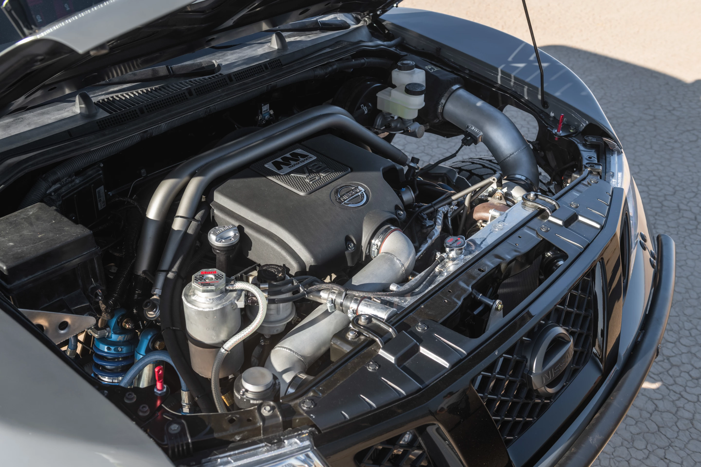 A race-spec rebuild of the engine made it even more implausible for the little Frontier, adding a Garrett GTX3584RS turbocharger, a customer intercooler, Jim Wolf Technology camshafts, pistons, and valves, and an MA Motorsports custom turbo header and exhaust