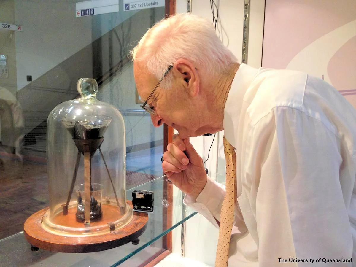 The pitch drop experiment at the University of Queensland being watched by Professor John Mainsfield, current keeper of the experiment (Photo: University of Queensland)