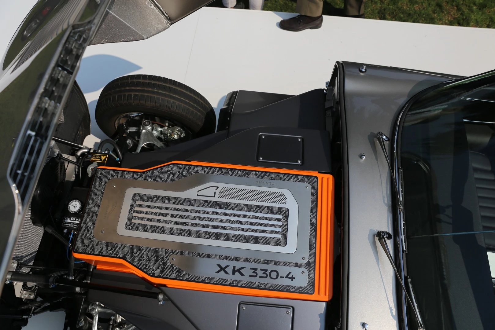 Lift the long bonnet of the the Jaguar E-Type Zero, and instead of a rce-cred DOHC six, there's an electric powerpack and motor of the same weight and dimensions