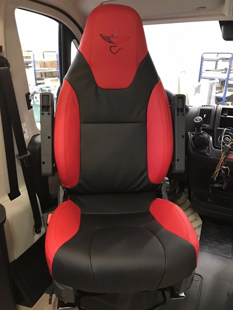 Red and black upholstery and furnishings make for a bold interior