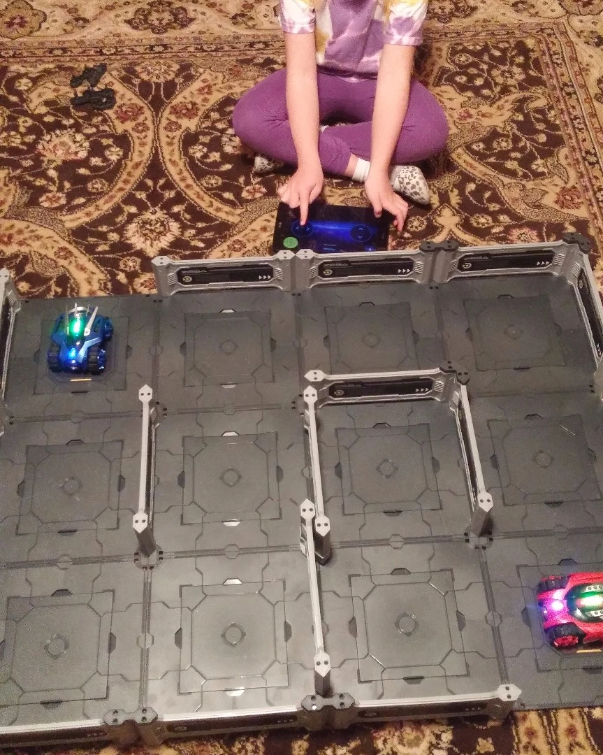 Here the Zega tanks are fully loaded and ready for battle. The author's daughter works the controller for one of the tanks