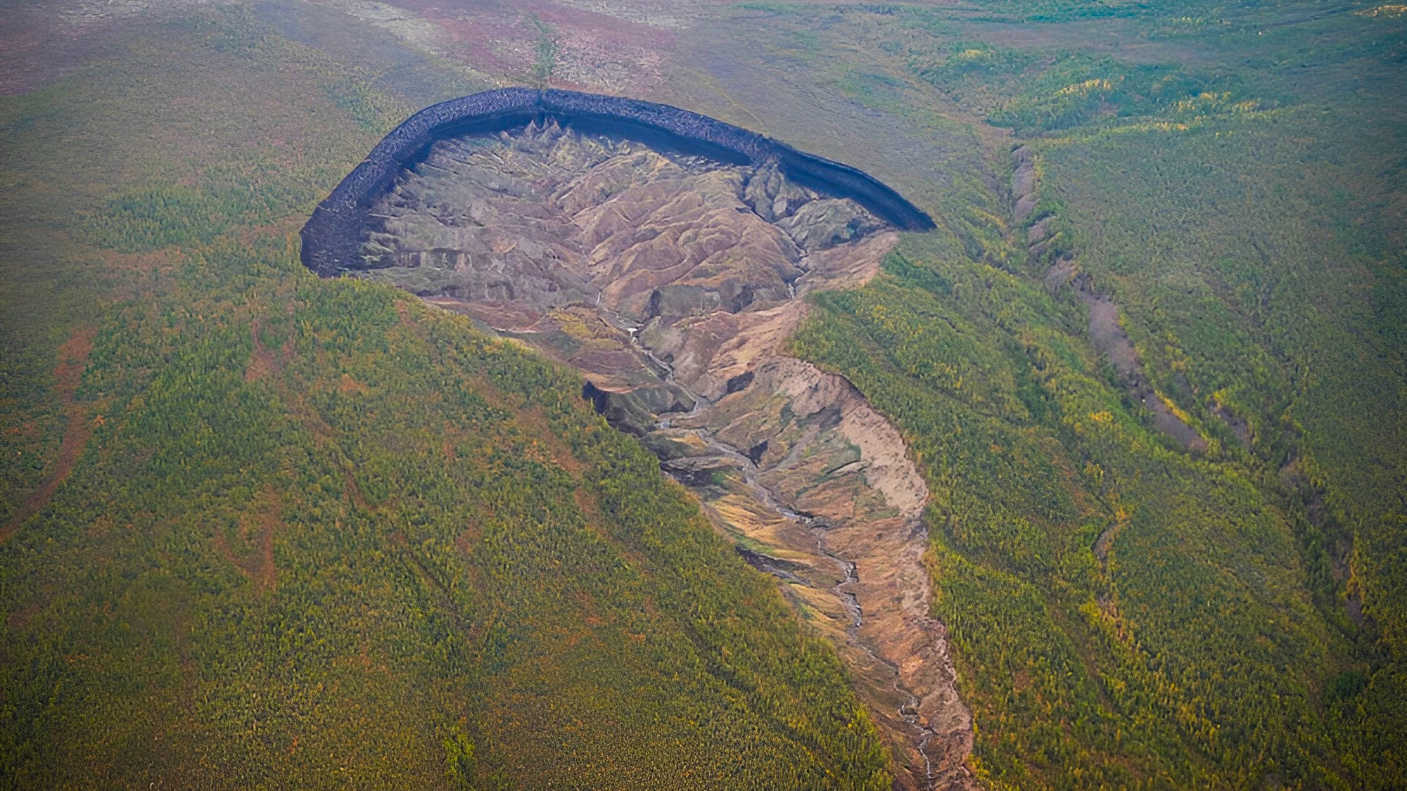 This ever-growing permafrost-destroying 'sink hole' was originally a small gully in the 1960s